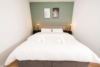 Möblierte 1,5 Zimmer-Wohnung mit Balkon - Schlafzimmer