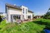 Wohnen ohne Kompromisse – Hochwertiges Traumhaus für Familien mit Stil - Gartenbereich