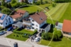 Attraktive 4,5-Zimmer-Dachgeschosswohnung mit Balkon, Garage und großem Garten - Außenansicht