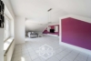 Attraktive 4,5-Zimmer-Dachgeschosswohnung mit Balkon, Garage und großem Garten - Wohnzimmer