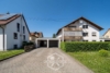 Attraktive 4,5-Zimmer-Dachgeschosswohnung mit Balkon, Garage und großem Garten - Außenansicht