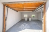 Attraktive 4,5-Zimmer-Dachgeschosswohnung mit Balkon, Garage und großem Garten - Garage
