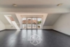 Großzügige 3-Zimmer-Maisonette mit Balkon und zwei Bädern - Wohnzimmer
